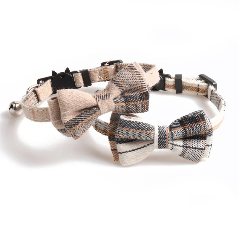 Two plaid bow tie dog collars on a white background