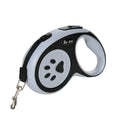 Laisse rétractable pour chien avec un motif noir et blanc sur fond blanc

